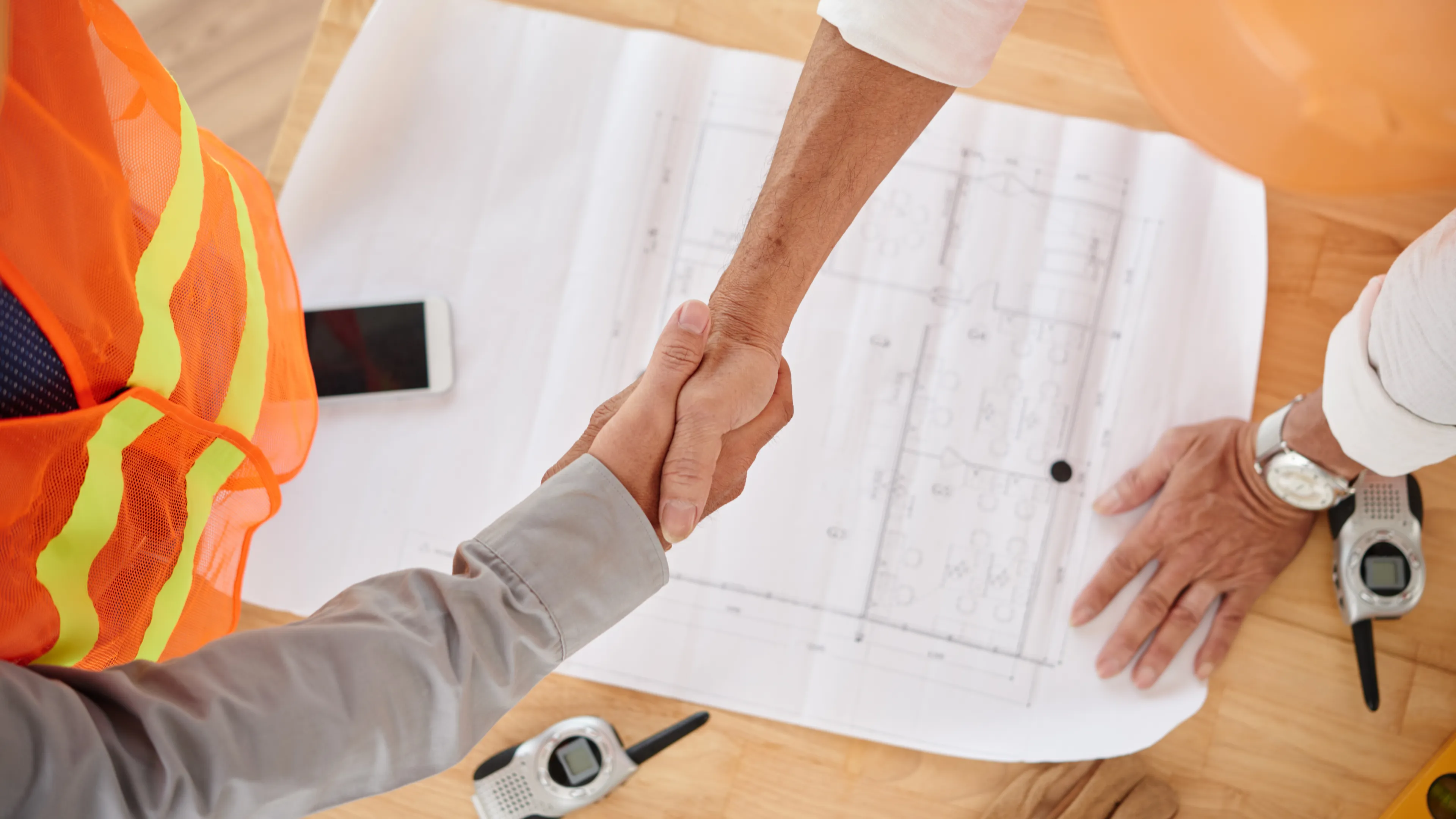 ADU Builders Dallas team planning custom backyard ADU project with homeowners