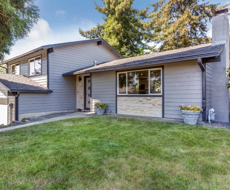 Attached ADU created from garage conversion with private front door and windows integrated into main home in Dallas Texas
