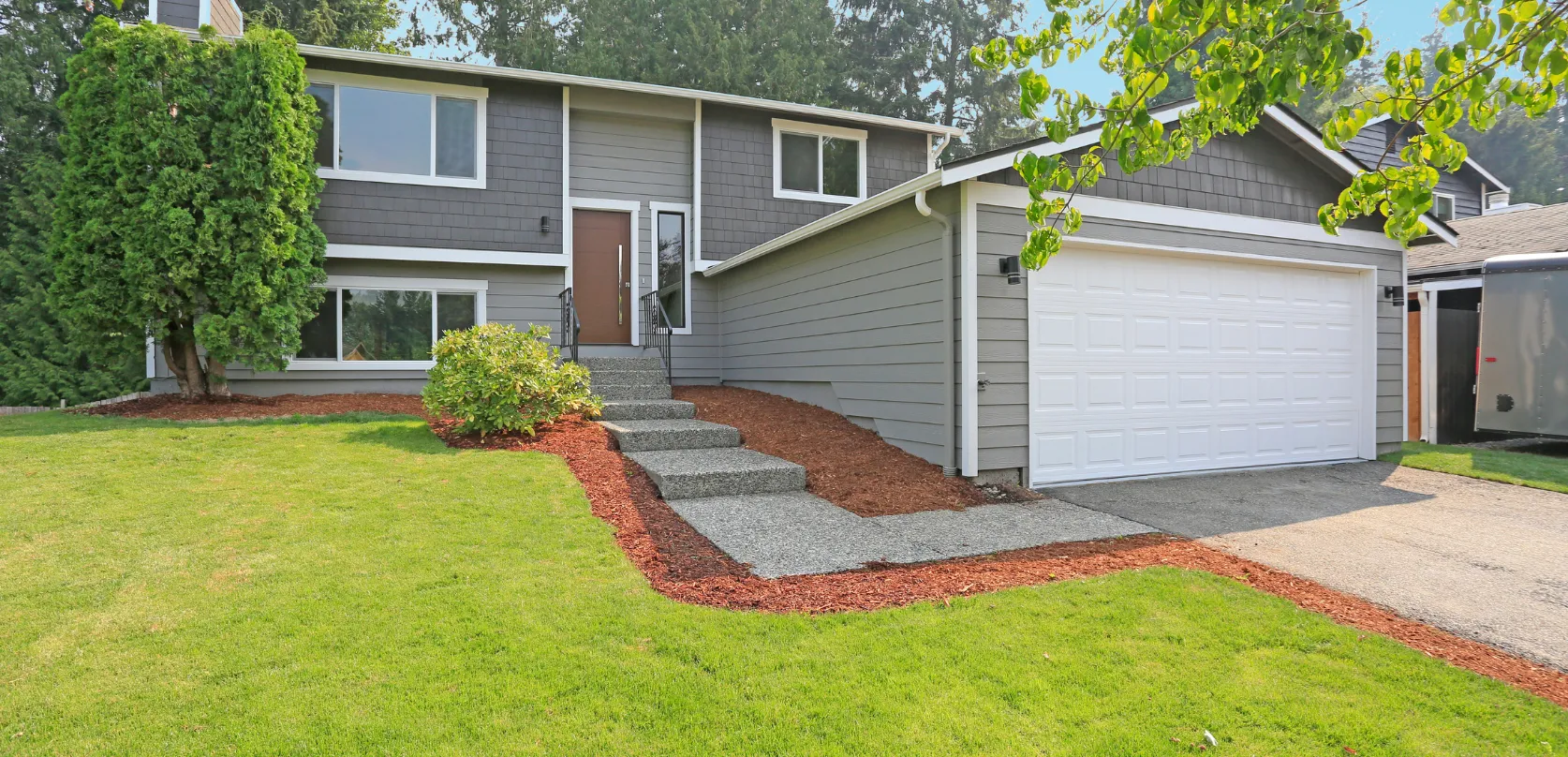 Modern in-law suite home addition with private side entrance attached to main house in Dallas Texas
